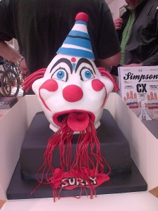 A novelty birthday cake with a clown's head