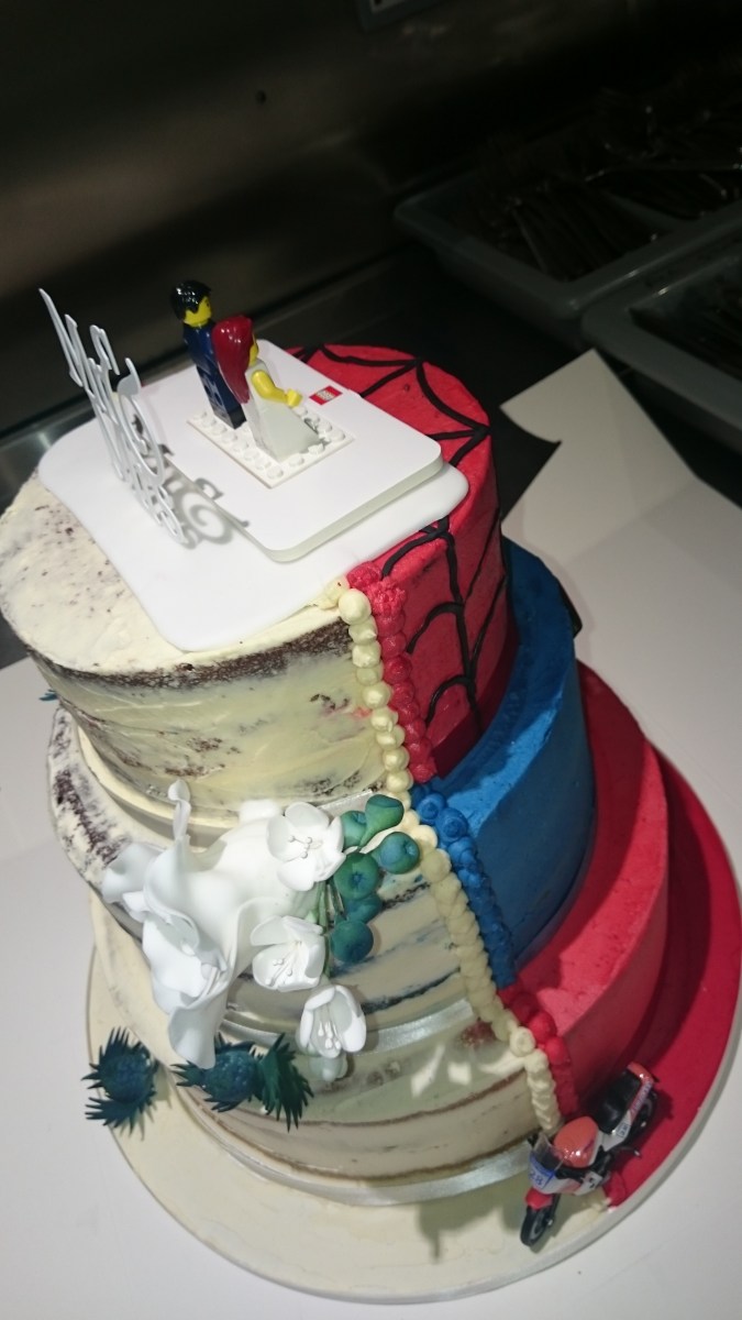 Semi-naked half and half wedding cake with handmade sugar flowers and superhero design