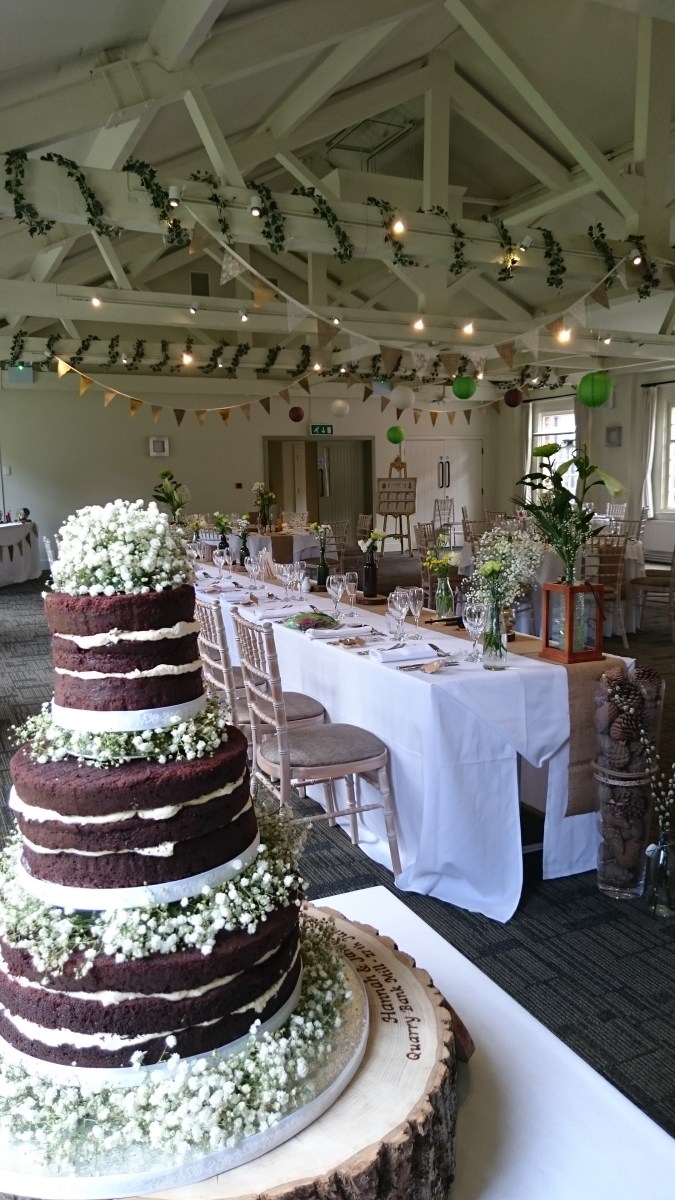 Rustic naked chocolate wedding cake with fresh gypsophila